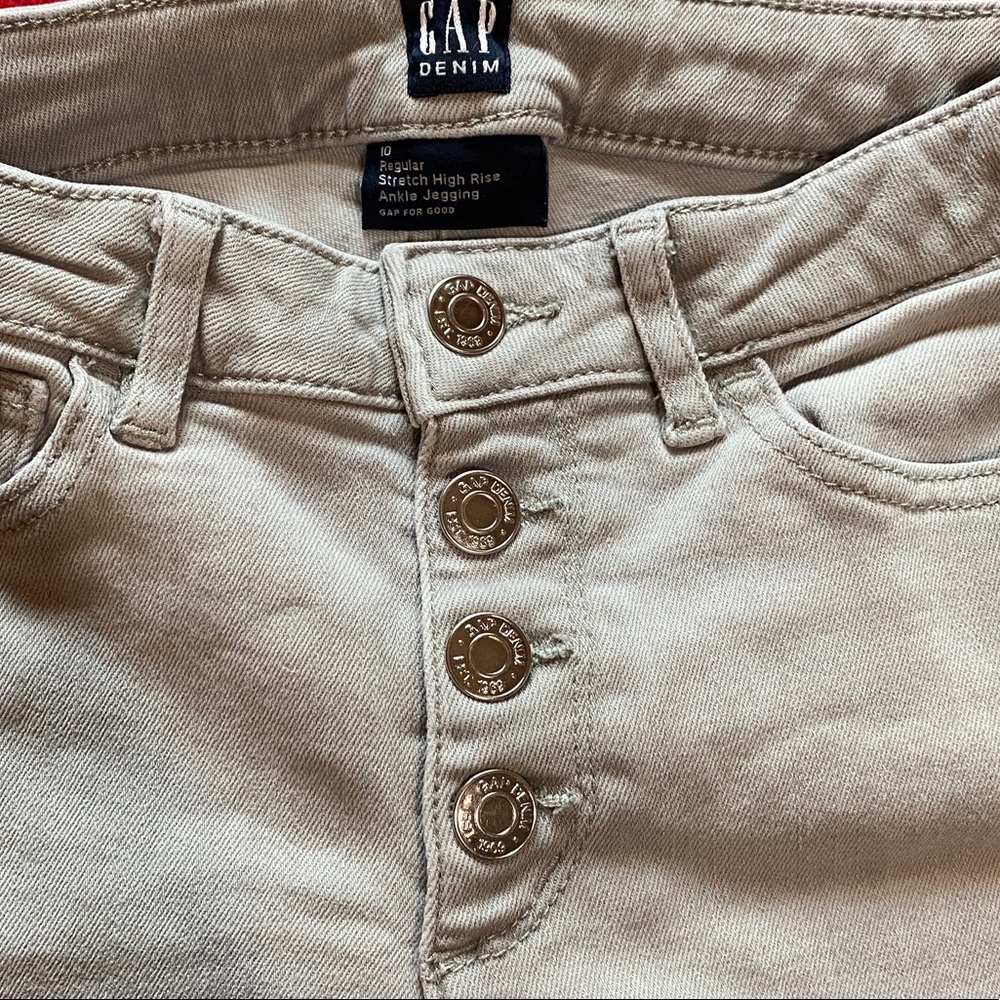 Size: 10, color: a light faded gray, a ripped style, high waisted